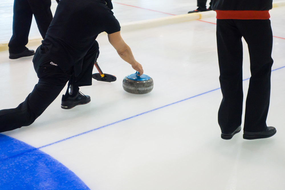 What is a hog line violation in curling?