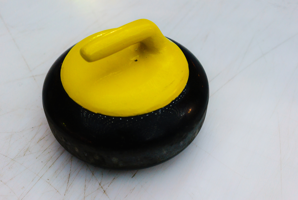 How much does a curling stone weigh?